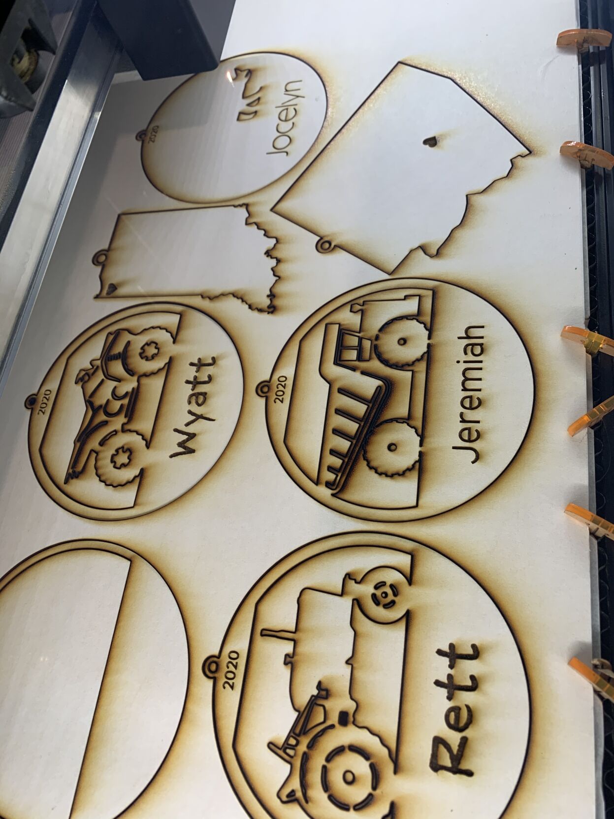 Laser cutter engraves ornaments